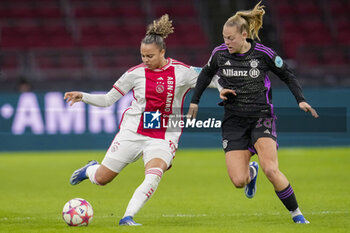 2023-12-20 - Chasity Grant of AFC Ajax battles for possession with Jill Baijings of Bayern Munich during the UEFA Women's Champions League, Group C football match between AFC Ajax and Bayern Munich on December 20, 2023 at Johan Cruijff ArenA in Amsterdam, Netherlands - FOOTBALL - WOMEN'S CHAMPIONS LEAGUE - AJAX V BAYERN MUNICH - UEFA CHAMPIONS LEAGUE WOMEN - SOCCER