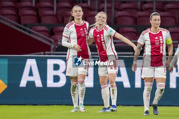2023-12-20 - Romée Leuchter, Nadine Noordam, Sherida Spitse of AFC Ajax celebrate after scoring his sides first goal during the UEFA Women's Champions League, Group C football match between AFC Ajax and Bayern Munich on December 20, 2023 at Johan Cruijff ArenA in Amsterdam, Netherlands - FOOTBALL - WOMEN'S CHAMPIONS LEAGUE - AJAX V BAYERN MUNICH - UEFA CHAMPIONS LEAGUE WOMEN - SOCCER