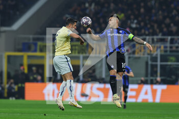 2023-02-22 - Ivan Marcano of FC Porto competes for the ball with Lautaro Martinez of FC Internazionale during the UEFA Champions League 2022/23 Round of 16 - First leg football match between FC Internazionale and FC Porto at Giuseppe Meazza Stadium, Milan, Italy on February 22, 2023 - INTER - FC INTERNAZIONALE VS FC PORTO - UEFA CHAMPIONS LEAGUE - SOCCER