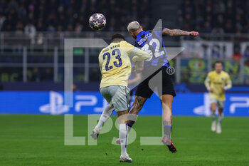 2023-02-22 - Federico Dimarco of FC Internazionale competes for the ball with Joao Mario of FC Porto during the UEFA Champions League 2022/23 Round of 16 - First leg football match between FC Internazionale and FC Porto at Giuseppe Meazza Stadium, Milan, Italy on February 22, 2023 - INTER - FC INTERNAZIONALE VS FC PORTO - UEFA CHAMPIONS LEAGUE - SOCCER