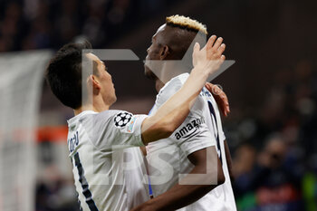 2023-02-21 - Victor Osimhen of Napoli celebrates after score their first gol with Hirving Lozano of Napoli  - EINTRACHT FRANKFURT VS NAPOLI - UEFA CHAMPIONS LEAGUE - SOCCER