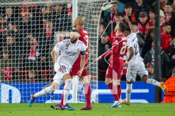 2023-02-21 - Real Madrid forward Karim Benzema (9) scores and celebrates 2-4 during the UEFA Champions League, Round of 16, 1st leg football match between Liverpool and Real Madrid on 21 February 2023 at Anfield in Liverpool, England - FOOTBALL - CHAMPIONS LEAGUE - LIVERPOOL V REAL MADRID - UEFA CHAMPIONS LEAGUE - SOCCER