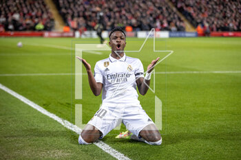 2023-02-21 - Real Madrid forward Vinicius Junior (20) scores and celebrates 2-2 during the UEFA Champions League, Round of 16, 1st leg football match between Liverpool and Real Madrid on 21 February 2023 at Anfield in Liverpool, England - FOOTBALL - CHAMPIONS LEAGUE - LIVERPOOL V REAL MADRID - UEFA CHAMPIONS LEAGUE - SOCCER