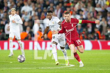 2023-02-21 - Real Madrid forward Vinicius Junior (20) and Liverpool midfielder Jordan Henderson (14) during the UEFA Champions League, Round of 16, 1st leg football match between Liverpool and Real Madrid on 21 February 2023 at Anfield in Liverpool, England - FOOTBALL - CHAMPIONS LEAGUE - LIVERPOOL V REAL MADRID - UEFA CHAMPIONS LEAGUE - SOCCER