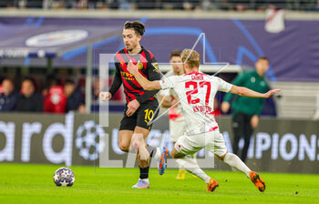 2023-02-23 - Jack Grealish (10) of Manchester City goes past Konrad Laimer (27) of RB Leipzig during the UEFA Champions League, Round of 16, 1st leg football match between RB Leipzig and Manchester City on February 22, 2023 at Red Bull Arena in Leipzig, Germany - FOOTBALL - CHAMPIONS LEAGUE - LEIPZIG V MANCHESTER CITY - UEFA CHAMPIONS LEAGUE - SOCCER