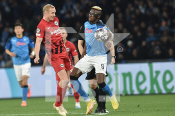 2023-03-15 - Victor Osimhen of SSC Napoli  competes for the ball with Sebastian Rode of Eintracht Frankfurt  during the Uefa Champions League  match between SSC Napoli v Eintracht Frankfurt  at Diego Armando Maradona Stadium  - SSC NAPOLI VS EINTRACHT FRANKFURT - UEFA CHAMPIONS LEAGUE - SOCCER