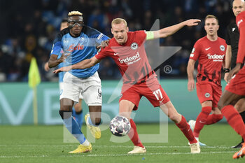 2023-03-15 - Victor Osimhen of SSC Napoli  competes for the ball with Sebastian Rode of Eintracht Frankfurt  during the Uefa Champions League  match between SSC Napoli v Eintracht Frankfurt  at Diego Armando Maradona Stadium  - SSC NAPOLI VS EINTRACHT FRANKFURT - UEFA CHAMPIONS LEAGUE - SOCCER