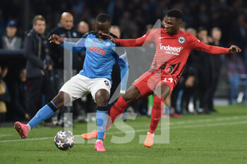 2023-03-15 - Tanguy Ndombele' of SSC Napoli  competes for the ball competes for the ball ewith Aurelio Buta during the Uefa Champions League  match between SSC Napoli v Eintracht Frankfurt  at Diego Armando Maradona Stadium  - SSC NAPOLI VS EINTRACHT FRANKFURT - UEFA CHAMPIONS LEAGUE - SOCCER