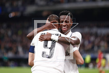 2023-03-15 - Karim Benzema of Real Madrid celebrates a goal 1-0 with Vinicius Junior during the UEFA Champions League, Round of 16, 2nd leg football match between Real Madrid CF and Liverpool FC on March 15, 2023 at Santiago Bernabeu stadium in Madrid, Spain - FOOTBALL - CHAMPIONS LEAGUE - REAL MADRID V LIVERPOOL - UEFA CHAMPIONS LEAGUE - SOCCER