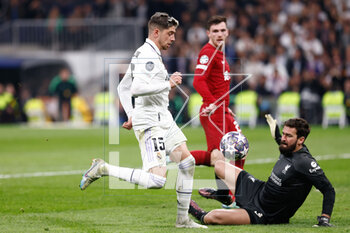 2023-03-15 - Federico Valverde of Real Madrid and Alisson Becker of Liverpool during the UEFA Champions League, Round of 16, 2nd leg football match between Real Madrid CF and Liverpool FC on March 15, 2023 at Santiago Bernabeu stadium in Madrid, Spain - FOOTBALL - CHAMPIONS LEAGUE - REAL MADRID V LIVERPOOL - UEFA CHAMPIONS LEAGUE - SOCCER