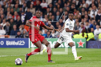 2023-03-15 - Vinicius Junior of Real Madrid and Ibrahima Konate of Liverpool during the UEFA Champions League, Round of 16, 2nd leg football match between Real Madrid CF and Liverpool FC on March 15, 2023 at Santiago Bernabeu stadium in Madrid, Spain - FOOTBALL - CHAMPIONS LEAGUE - REAL MADRID V LIVERPOOL - UEFA CHAMPIONS LEAGUE - SOCCER
