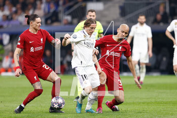 2023-03-15 - Luka Modric of Real Madrid and Darwin Nunez, Fabinho of Liverpool during the UEFA Champions League, Round of 16, 2nd leg football match between Real Madrid CF and Liverpool FC on March 15, 2023 at Santiago Bernabeu stadium in Madrid, Spain - FOOTBALL - CHAMPIONS LEAGUE - REAL MADRID V LIVERPOOL - UEFA CHAMPIONS LEAGUE - SOCCER