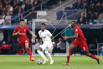 2023-03-15 - Vinicius Junior of Real Madrid and Cody Gakpo, Ibrahima Konate of Liverpool during the UEFA Champions League, Round of 16, 2nd leg football match between Real Madrid CF and Liverpool FC on March 15, 2023 at Santiago Bernabeu stadium in Madrid, Spain - FOOTBALL - CHAMPIONS LEAGUE - REAL MADRID V LIVERPOOL - UEFA CHAMPIONS LEAGUE - SOCCER