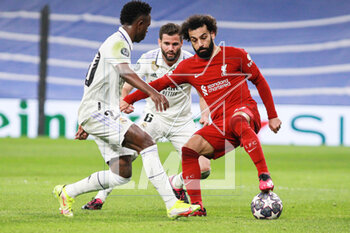 2023-03-15 - Mohamed Salah of Liverpool FC and Vinicius Junior of Real Madrid during the UEFA Champions League, Round of 16, 2nd leg football match between Real Madrid CF and Liverpool FC on March 15, 2023 at Santiago Bernabeu stadium in Madrid, Spain - FOOTBALL - CHAMPIONS LEAGUE - REAL MADRID V LIVERPOOL - UEFA CHAMPIONS LEAGUE - SOCCER