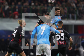 2023-04-12 - Giovanni Di Lorenzo of SSC Napoli competes for the ball with Olivier Giroud of AC Milan during UEFA Champions League 2022/23 Quarter-Finals - First  leg football match between AC Milan and SSC Napoli at San Siro Stadium, Milan, Italy on April 12, 2023 - AC MILAN VS SSC NAPOLI - UEFA CHAMPIONS LEAGUE - SOCCER