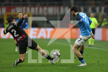 2023-04-12 - Davide Calabria of AC Milan competes for the ball with Khvicha Kvaratskhelia of SSC Napoli during UEFA Champions League 2022/23 Quarter-Finals - First  leg football match between AC Milan and SSC Napoli at San Siro Stadium, Milan, Italy on April 12, 2023 - AC MILAN VS SSC NAPOLI - UEFA CHAMPIONS LEAGUE - SOCCER