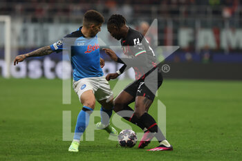 2023-04-12 - Rafael Leao of AC Milan competes for the ball with Giovanni Di Lorenzo of SSC Napoli during UEFA Champions League 2022/23 Quarter-Finals - First  leg football match between AC Milan and SSC Napoli at San Siro Stadium, Milan, Italy on April 12, 2023 - AC MILAN VS SSC NAPOLI - UEFA CHAMPIONS LEAGUE - SOCCER