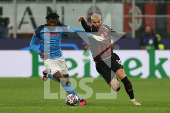 2023-04-12 - Andre Anguissa of SSC Napoli competes for the ball with Theo Hernandez of AC Milan during UEFA Champions League 2022/23 Quarter-Finals - First  leg football match between AC Milan and SSC Napoli at San Siro Stadium, Milan, Italy on April 12, 2023 - AC MILAN VS SSC NAPOLI - UEFA CHAMPIONS LEAGUE - SOCCER