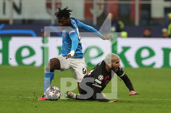 2023-04-12 - Andre Anguissa of SSC Napoli competes for the ball with Theo Hernandez of AC Milan during UEFA Champions League 2022/23 Quarter-Finals - First  leg football match between AC Milan and SSC Napoli at San Siro Stadium, Milan, Italy on April 12, 2023 - AC MILAN VS SSC NAPOLI - UEFA CHAMPIONS LEAGUE - SOCCER