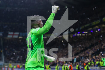 2023-04-19 - Andre Onana of FC Internazionale celebrates the victory at the end of the match during the UEFA Champions League 2022/23 Quarter-Finals - 2nd leg football match between FC Internazionale and SL Benfica at Giuseppe Meazza Stadium, Milan, Italy on April 19, 2023 - INTER - FC INTERNAZIONALE VS BENFICA - UEFA CHAMPIONS LEAGUE - SOCCER