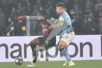 2023-04-18 - Rafael Leao of AC Milan competes for the ball with Giovanni Di Lorenzo of SSC Napoli  during the Uefa Champions League  match between SSC Napoli vs AC Milan  at Diego Armando Maradona Stadium - SSC NAPOLI VS AC MILAN - UEFA CHAMPIONS LEAGUE - SOCCER