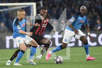 2023-04-18 - Rafael Leao of AC Milan competes for the ball with Tanguy Ndombele' of SSC Napoli   during the Uefa Champions League  match between SSC Napoli vs AC Milan  at Diego Armando Maradona Stadium - SSC NAPOLI VS AC MILAN - UEFA CHAMPIONS LEAGUE - SOCCER