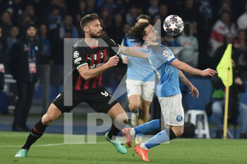 2023-04-18 - Olivier Giroud of AC Milan competes for the ball with Mario Rui of SSC Napoli  during the Uefa Champions League  match between SSC Napoli vs AC Milan  at Diego Armando Maradona Stadium - SSC NAPOLI VS AC MILAN - UEFA CHAMPIONS LEAGUE - SOCCER