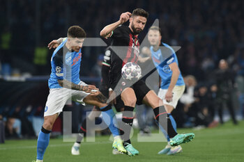 2023-04-18 - Olivier Giroud of AC Milan competes for the ball with Giovanni Di Lorenzo of SSC Napoli   during the Uefa Champions League  match between SSC Napoli vs AC Milan  at Diego Armando Maradona Stadium - SSC NAPOLI VS AC MILAN - UEFA CHAMPIONS LEAGUE - SOCCER