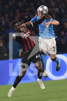 2023-04-18 - Leo Ostigard of SSC Napoli   competes for the ball with Dicock Origi of AC Milan during the Uefa Champions League  match between SSC Napoli vs AC Milan  at Diego Armando Maradona Stadium - SSC NAPOLI VS AC MILAN - UEFA CHAMPIONS LEAGUE - SOCCER