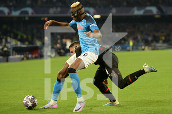 2023-04-18 - Victor Osimhen of SSC Napoli  competes for the ball with Ismael Bennacer of AC Milan  during the Uefa Champions League  match between SSC Napoli vs AC Milan  at Diego Armando Maradona Stadium - SSC NAPOLI VS AC MILAN - UEFA CHAMPIONS LEAGUE - SOCCER