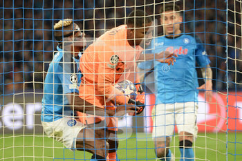 2023-04-18 - Victor Osimhen of SSC Napoli wants to take the ball from Mike Maigan of AC Milan   during the Uefa Champions League  match between SSC Napoli vs AC Milan  at Diego Armando Maradona Stadium - SSC NAPOLI VS AC MILAN - UEFA CHAMPIONS LEAGUE - SOCCER