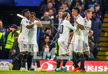 2023-04-19 - Rodrygo (21) of Real Madrid scores a goal and celebrates 0-1 with teammates during the UEFA Champions League, Quarter-finals, 2nd leg football match between Chelsea and Real Madrid on 18 April 2023 at Stamford Bridge in London, England - FOOTBALL - CHAMPIONS LEAGUE - CHELSEA V REAL MADRID - UEFA CHAMPIONS LEAGUE - SOCCER