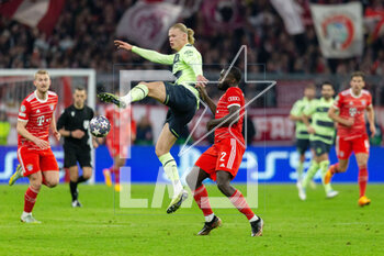 2023-04-19 - Manchester City forward Erling Haaland (9) and Dayot Upamecano of Bayern Munich during the UEFA Champions League, Quarter-finals, 2nd leg football match between Bayern Munich and Manchester City on 19 April 2023 at Allianz Arena in Munich, Germany - FOOTBALL - CHAMPIONS LEAGUE - BAYERN MUNICH V MANCHESTER CITY - UEFA CHAMPIONS LEAGUE - SOCCER