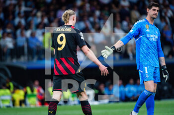 2023-05-09 - Erling Haaland (Manchester City) and Thibaut Courtois (Real Madrid) during the football match between
Real Madrid and Manchester City valid for the semi final of the Uefa Champion’s League celebrated in Madrid, Spain at Bernabeu Stadium on Tuesday 09 May 2023 - SEMIFINAL - REAL MADRID VS MANCHESTER CITY - UEFA CHAMPIONS LEAGUE - SOCCER