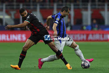 2023-05-10 - Henrikh Mkhitaryan of FC Internazionale competes for the ball with Junior Messias of AC Milan during UEFA Champions League 2022/23 Semi-Final 1st  leg football match between AC Milan and FC Internazionale at San Siro Stadium, Milan, Italy on May 10, 2023 - SEMIFINAL - AC MILAN VS INTER - FC INTERNAZIONALE - UEFA CHAMPIONS LEAGUE - SOCCER