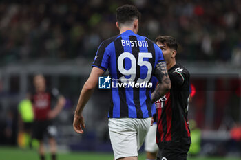 2023-05-10 - Brahim Diaz of AC Milan protests with Alessandro Bastoni of FC Internazionale during UEFA Champions League 2022/23 Semi-Final 1st  leg football match between AC Milan and FC Internazionale at San Siro Stadium, Milan, Italy on May 10, 2023 - SEMIFINAL - AC MILAN VS INTER - FC INTERNAZIONALE - UEFA CHAMPIONS LEAGUE - SOCCER
