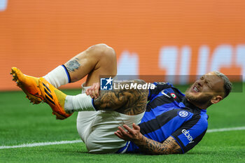 2023-05-10 - Federico Dimarco of FC Internazionale injured during UEFA Champions League 2022/23 Semi-Final 1st  leg football match between AC Milan and FC Internazionale at San Siro Stadium, Milan, Italy on May 10, 2023 - SEMIFINAL - AC MILAN VS INTER - FC INTERNAZIONALE - UEFA CHAMPIONS LEAGUE - SOCCER