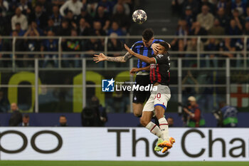 2023-05-16 - Junior Messias of AC Milan competes for the ball with Alessandro Bastoni of FC Internazionale during the UEFA Champions League 2022/23 Semi-Final second leg football match between FC Internazionale and AC Milan at Giuseppe Meazza Stadium, Milan, Italy on May 16, 2023 - SEMIFINAL - INTER - FC INTERNAZIONALE VS AC MILAN - UEFA CHAMPIONS LEAGUE - SOCCER