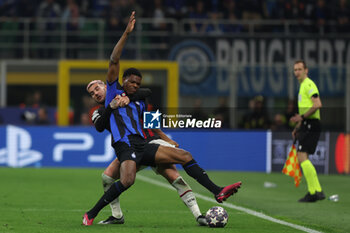 2023-05-16 - Denzel Dumfries of FC Internazionale competes for the ball with Theo Hernandez of AC Milan during the UEFA Champions League 2022/23 Semi-Final second leg football match between FC Internazionale and AC Milan at Giuseppe Meazza Stadium, Milan, Italy on May 16, 2023 - SEMIFINAL - INTER - FC INTERNAZIONALE VS AC MILAN - UEFA CHAMPIONS LEAGUE - SOCCER