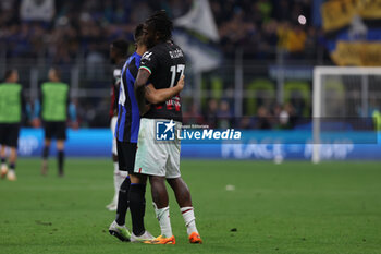 2023-05-16 - Rafael Leao of AC Milan hugs Rafael Leao of AC Milan at the end of the match during the UEFA Champions League 2022/23 Semi-Final second leg football match between FC Internazionale and AC Milan at Giuseppe Meazza Stadium, Milan, Italy on May 16, 2023 - SEMIFINAL - INTER - FC INTERNAZIONALE VS AC MILAN - UEFA CHAMPIONS LEAGUE - SOCCER