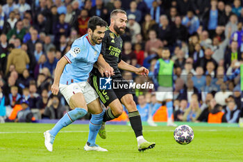 2023-05-18 - İlkay Gundogan (8) of Manchester City tussles with Daniel Carvajal (2) of Real Madrid during the UEFA Champions League, Semi-finals, 2nd leg football match between Manchester City and Real Madrid on 17 May 2023 at the Etihad Stadium in Manchester, England - FOOTBALL - CHAMPIONS LEAGUE - MANCHESTER CITY V REAL MADRID - UEFA CHAMPIONS LEAGUE - SOCCER
