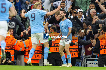 2023-05-18 - Bernardo Silva (20) of Manchester City scores a goal and celebrates with Erling Haaland 2-0 during the UEFA Champions League, Semi-finals, 2nd leg football match between Manchester City and Real Madrid on 17 May 2023 at the Etihad Stadium in Manchester, England - FOOTBALL - CHAMPIONS LEAGUE - MANCHESTER CITY V REAL MADRID - UEFA CHAMPIONS LEAGUE - SOCCER