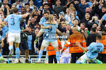 2023-05-18 - Bernardo Silva (20) of Manchester City scores a goal and celebrates with Erling Haaland 1-0 during the UEFA Champions League, Semi-finals, 2nd leg football match between Manchester City and Real Madrid on 17 May 2023 at the Etihad Stadium in Manchester, England - FOOTBALL - CHAMPIONS LEAGUE - MANCHESTER CITY V REAL MADRID - UEFA CHAMPIONS LEAGUE - SOCCER