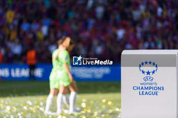 2023-06-03 - 03.06.2023, Eindhoven, PSV Stadion, UEFA Women's Champions League: Barcelona - Wofsburg, UEFA womens champions league logo and lettering with blurred players of VFL Wolfsburg in the background - UEFA WOMEN'S CHAMPIONS LEAGUE: BARCELONA - WOFSBURG - UEFA CHAMPIONS LEAGUE - SOCCER