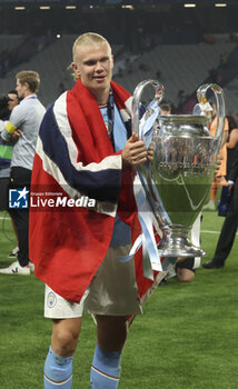 2023-06-10 - Erling Haaland of Manchester City celebrates with the trophy following the UEFA Champions League Final football match between Manchester City FC and FC Internazionale (Inter Milan) on June 10, 2023 at Ataturk Olympic Stadium in Istanbul, Turkey - FOOTBALL - CHAMPIONS LEAGUE - FINAL - MANCHESTER CITY V INTERNAZIONALE - UEFA CHAMPIONS LEAGUE - SOCCER