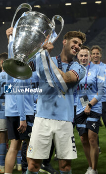 2023-06-10 - John Stones of Manchester City celebrates with the trophy following the UEFA Champions League Final football match between Manchester City FC and FC Internazionale (Inter Milan) on June 10, 2023 at Ataturk Olympic Stadium in Istanbul, Turkey - FOOTBALL - CHAMPIONS LEAGUE - FINAL - MANCHESTER CITY V INTERNAZIONALE - UEFA CHAMPIONS LEAGUE - SOCCER