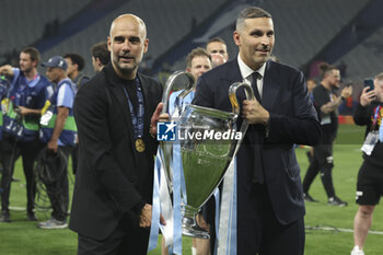 2023-06-10 - Coach of Manchester City Pep Guardiola and Manchester City President Khaldoon Al Mubarak celebrate with the trophy following the UEFA Champions League Final football match between Manchester City FC and FC Internazionale (Inter Milan) on June 10, 2023 at Ataturk Olympic Stadium in Istanbul, Turkey - FOOTBALL - CHAMPIONS LEAGUE - FINAL - MANCHESTER CITY V INTERNAZIONALE - UEFA CHAMPIONS LEAGUE - SOCCER