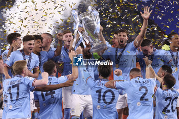 2023-06-10 - Captain Ilkay Gundogan of Manchester City and teammates celebrate during the trophy ceremony following the UEFA Champions League, Final football match between Manchester City FC and FC Internazionale (Inter Milan) on June 10, 2023 at Ataturk Olympic Stadium in Istanbul, Turkey - FOOTBALL - CHAMPIONS LEAGUE - FINAL - MANCHESTER CITY V INTERNAZIONALE - UEFA CHAMPIONS LEAGUE - SOCCER