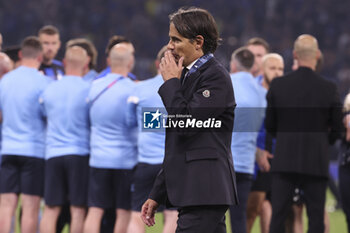 2023-06-10 - Coach of Inter Milan Simone Inzaghi looks dejected during the trophy ceremony following the UEFA Champions League, Final football match between Manchester City FC and FC Internazionale (Inter Milan) on June 10, 2023 at Ataturk Olympic Stadium in Istanbul, Turkey - FOOTBALL - CHAMPIONS LEAGUE - FINAL - MANCHESTER CITY V INTERNAZIONALE - UEFA CHAMPIONS LEAGUE - SOCCER
