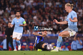 2023-06-10 - Erling Haaland of Manchester City, Hakan Calhanoglu of Inter Milan (left) during the UEFA Champions League, Final football match between Manchester City FC and FC Internazionale on June 10, 2023 at Ataturk Olympic Stadium in Istanbul, Turkey - FOOTBALL - CHAMPIONS LEAGUE - FINAL - MANCHESTER CITY V INTERNAZIONALE - UEFA CHAMPIONS LEAGUE - SOCCER